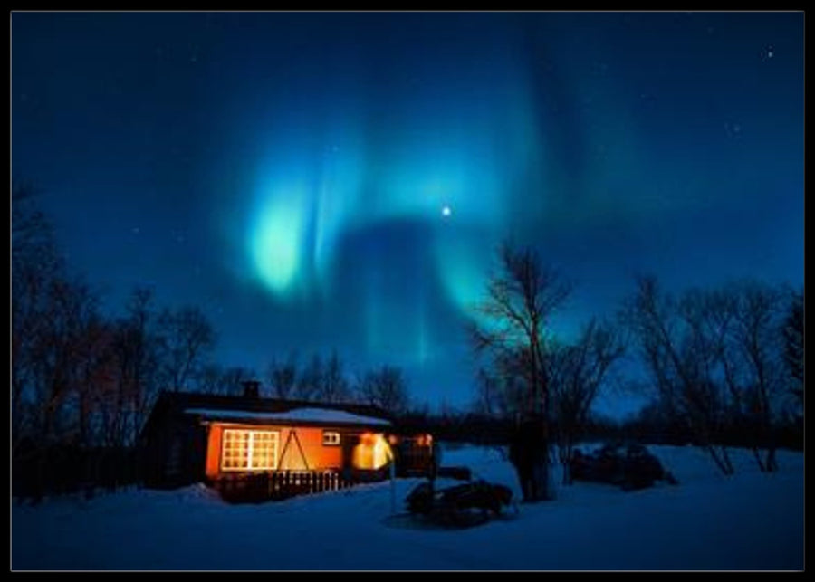 Northern lights over cabin in the mountains posters